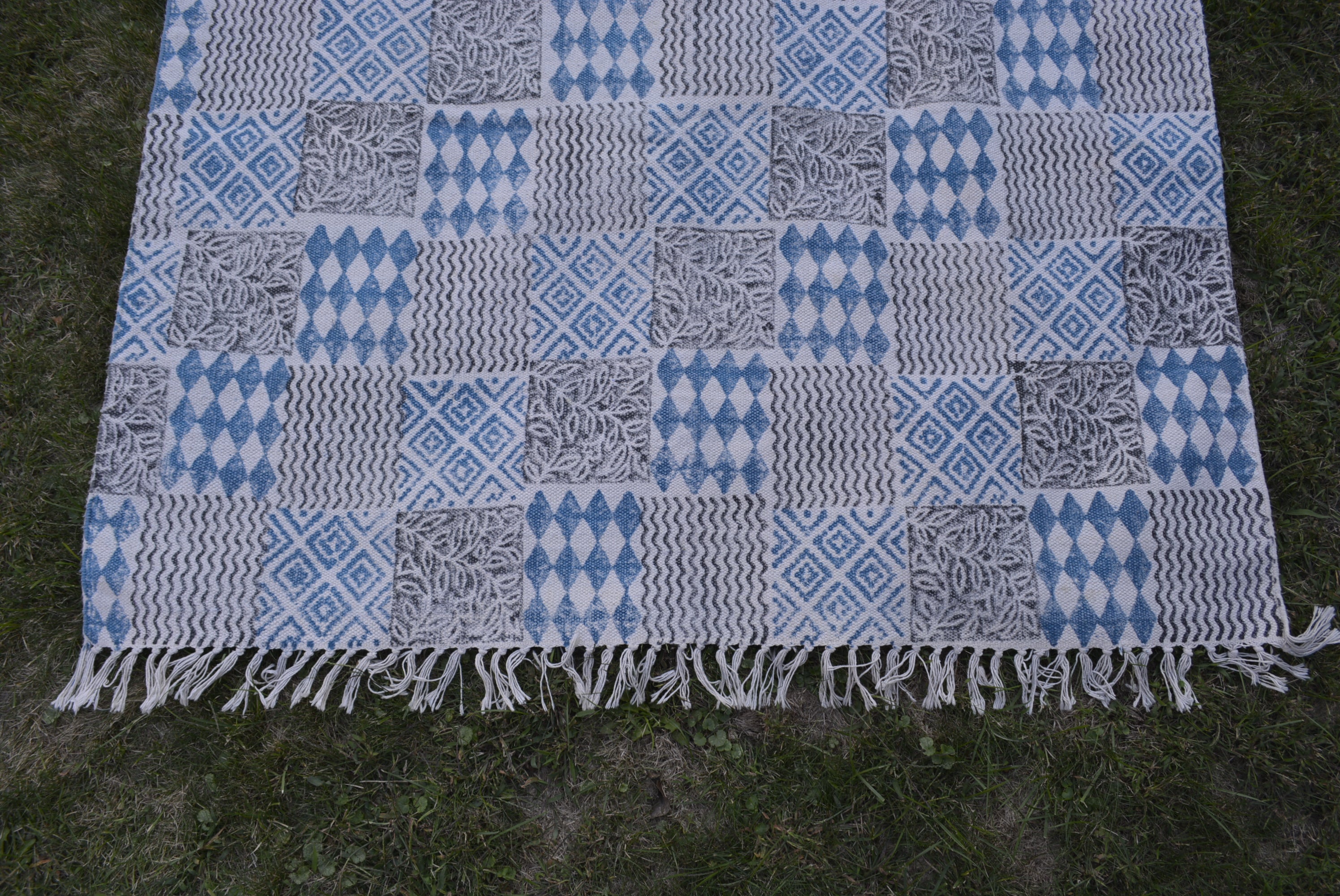 INDIGO DYED HANDWOVEN BLOCK PRINTED COTTON RUG WITH FLORAL DESIGN